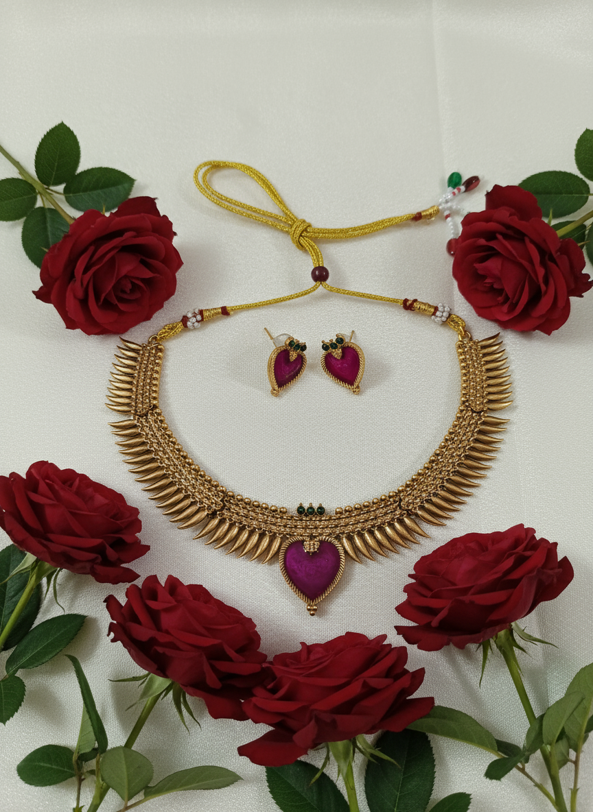 Necklace set on white satin with red roses