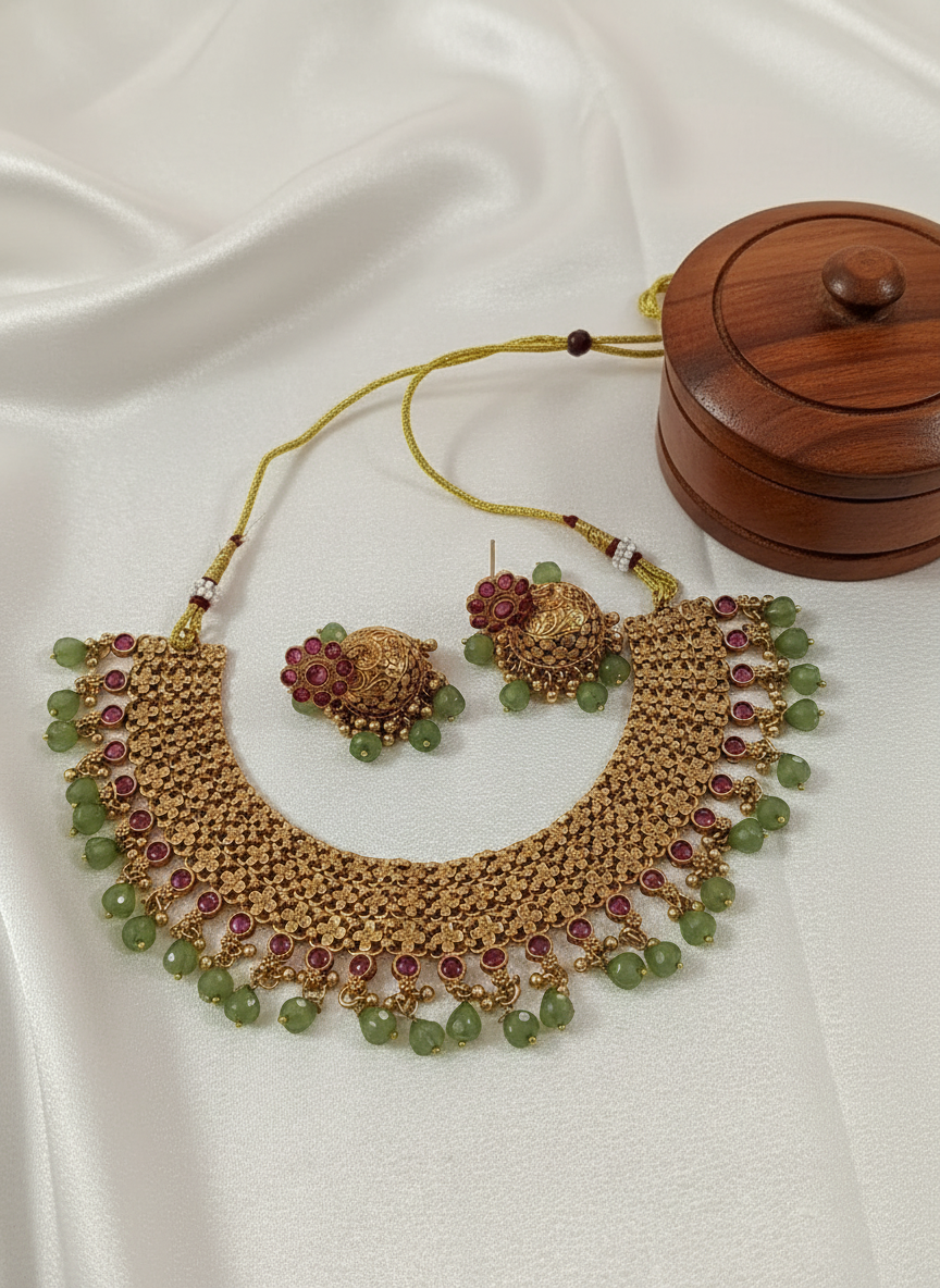 Temple jewelry necklace on white satin with kumkum box